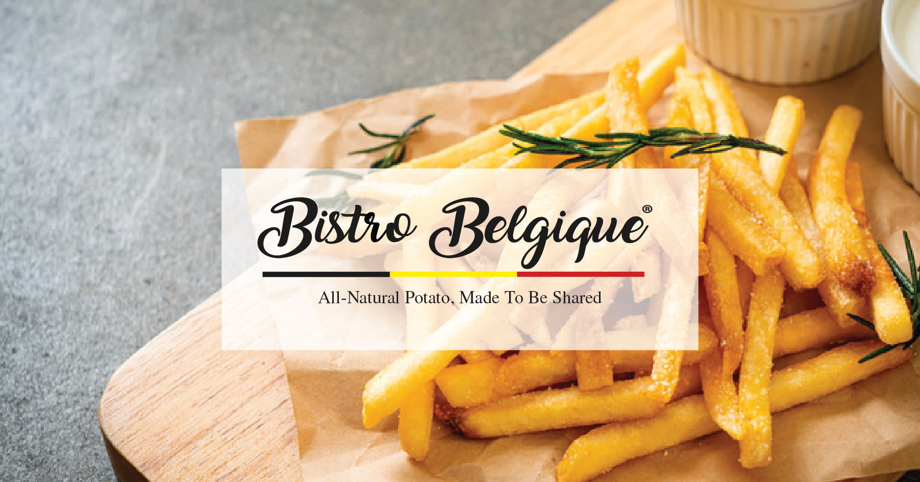 French fries on a wooden board with 'Bistro Belgique' branding.